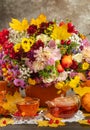 Tea in glass. The concept of autumn still life with tea. Autumn bouquet with aster pumpkins and yellow leaves