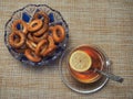 Tea in a glass Cup with lemon and bagels with poppy seeds Royalty Free Stock Photo