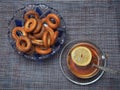 Tea in a glass Cup with lemon and bagels with poppy seeds Royalty Free Stock Photo