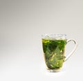 Tea glass with dried nettle tea Royalty Free Stock Photo