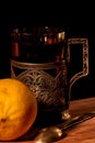 Tea in a glass holder and lemon