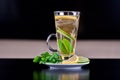Tea glass with teabag and lime slices Royalty Free Stock Photo