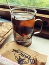 Tea in a glass and a typical Russian hot glass holder, hot tea on the train