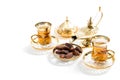 Tea glasses dates white background Oriental hospitality