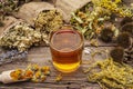 Tea with honey. Herbal harvest collection and bouquets of wild herbs. Alternative medicine. Natural pharmacy, self-care concept