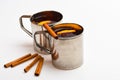 Tea or hot drink in metal mug with slise of orange. Mulled wine or beverage with cinnamon and anise. Hot beverage