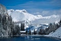 Tea House  at Lake Agnes in mountains covered with snow by blue alpine lake. Royalty Free Stock Photo