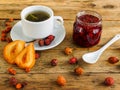 Tea, jam and dried fruit on an old wooden table Royalty Free Stock Photo