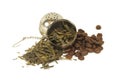 Tea leaves and coffee beans with strainer Royalty Free Stock Photo