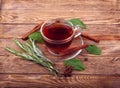 Tea and tea leaves on wooden table Royalty Free Stock Photo