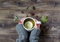 Tea with lemon, hand in a sweater. Top view