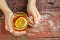 Tea with lemon. Hands. The concept of drinks, lifestyle. Royalty Free Stock Photo