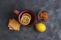 Tea with lemon, honey and grain biscuits. Traditional folk remedy for colds