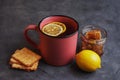 Tea with lemon, honey and grain biscuits. Traditional folk remedy for colds