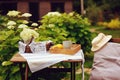 Tea with lemon in morning summer garden with blooming hydrangea