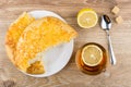 Tea with lemon, pieces of flat bread with cheese, sugar Royalty Free Stock Photo