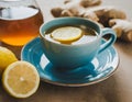 Tea with lemon slices, honey and ginger. A warming drink. Blue cup