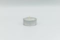 Tea light candle isolated on white background Royalty Free Stock Photo
