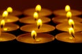 Tea lights candles with fire Royalty Free Stock Photo