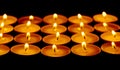 Tea lights candles with fire Royalty Free Stock Photo