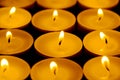 Tea lights candles with fire Royalty Free Stock Photo