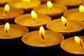 Tea lights candles with fire Royalty Free Stock Photo