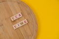 Tea Menu Concept. Scrabble Letter Tiles On Wooden Table. Yellow Background
