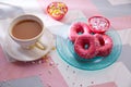 Tea with milk breakfast with pink donas