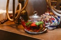 Tea with mint and strawberries in a transparent teapot Royalty Free Stock Photo