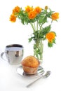 Tea with muffin and a globeflower Royalty Free Stock Photo