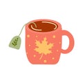 Tea mug with maple leaf pattern Royalty Free Stock Photo