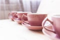 4 tea mugs on wood table