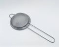 objects: Strainer Tea Orange Drink made of stainless, on white background. Royalty Free Stock Photo