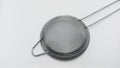 objects: Strainer Tea Orange Drink made of stainless, on white background. Royalty Free Stock Photo