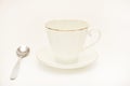 Tea pair on a white background. A cup and saucer with a spoon Royalty Free Stock Photo