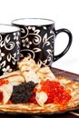 Tea and a pancakes with caviar