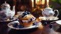 Tea party with blueberry muffins with powdered sugar and fresh berries. Generative AI