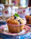 Tea party with blueberry muffins with powdered sugar and fresh berries. Generative AI