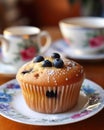 Tea party with blueberry muffins with powdered sugar and fresh berries. Generative AI