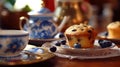 Tea party with blueberry muffins with powdered sugar and fresh berries. Generative AI