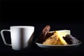 Tea cup of morning drink  waffles  biscuits on the black background. Romantic breakfast Royalty Free Stock Photo
