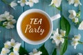 Tea party. Jasmine tea on a blue wooden background. Relaxing jasmine tea. Aromatic teas for relaxation and health