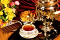 Tea party - samovar, sweet dessert cookies and fragrant confectionery chocolate, Russian traditions. Samovar Ã¢â¬â a metal vessel