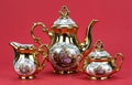 Tea porcelain set on a red background Royalty Free Stock Photo