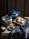 A tea pot, bowl, spoon, bowl of sugar and a plate of dumplings on a table. AI generative image . Korean still life. Royalty Free Stock Photo