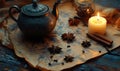 A tea pot with a candle and some spices on a table Royalty Free Stock Photo
