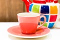 Tea pot and cup isolated on background. Royalty Free Stock Photo