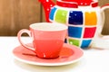 Tea pot and cup isolated on background. Royalty Free Stock Photo