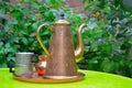 Tea-pot and metal cups