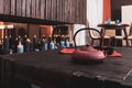 Tea pot with two cups on a wooden table with many candles burning on a background Royalty Free Stock Photo